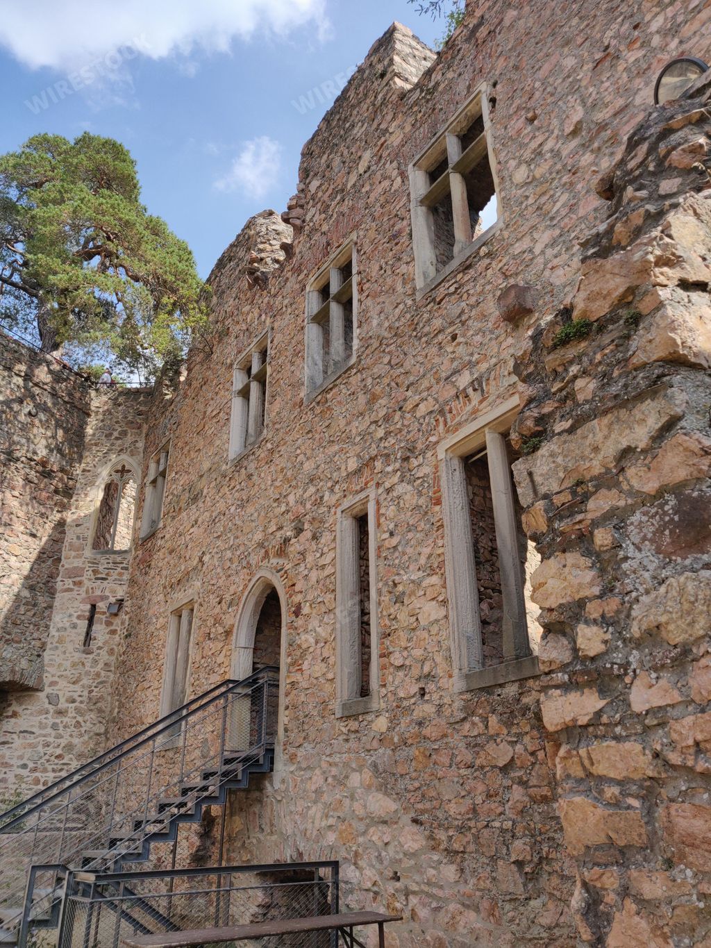 Beautiful shot of famous Auerbach castle ruins and Rhine valley view on summer day under blue sky, Bensheim, Germany