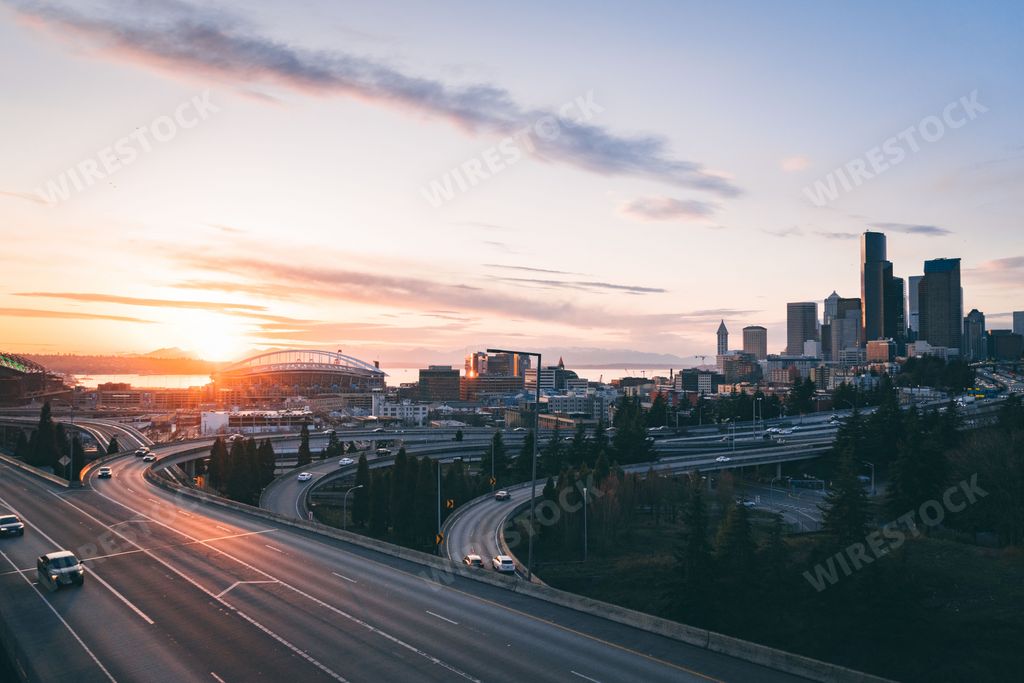 A skyline of modern Seattle on the sunset
