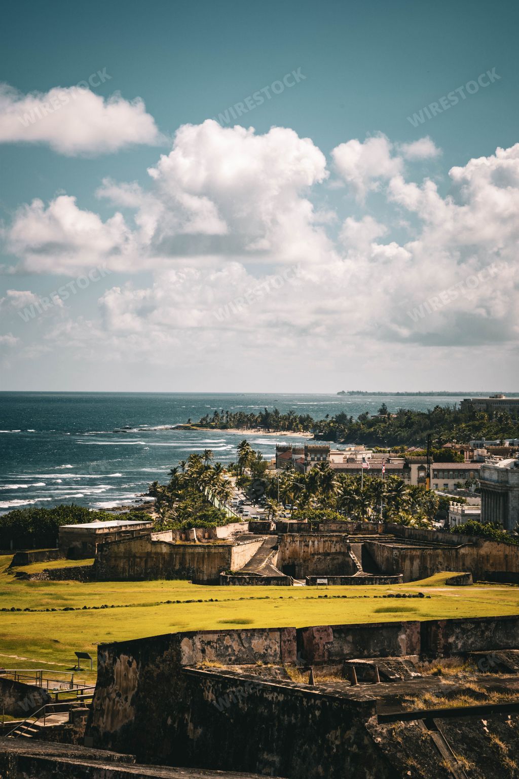 A vertical shot of the Castle of San Cristobal with cloudy sky in background, San Juan, Puerto Rico