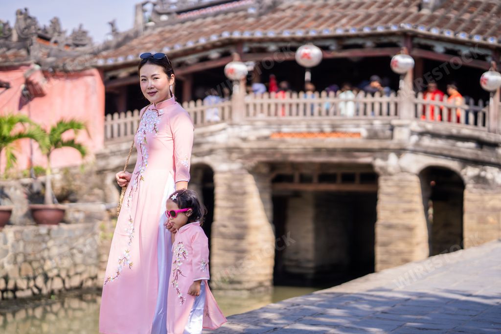 A beautiful shot of an Asian mother and daughter in Japanese Covered Bridge