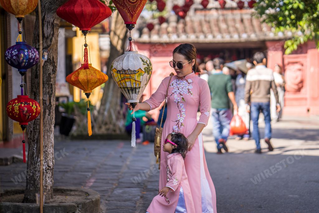 A beautiful shot of an Asian mother and daughter in a street