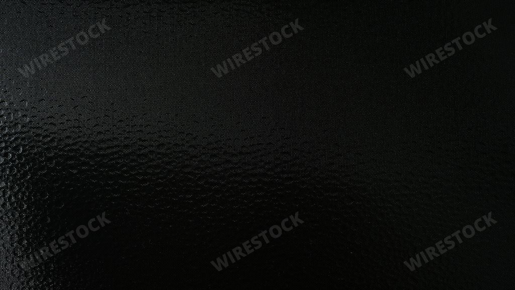 A closeup of black sequin fabric material as a background