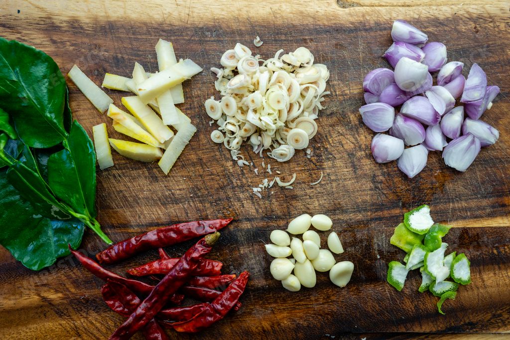 A top view of different spices on a cutting board