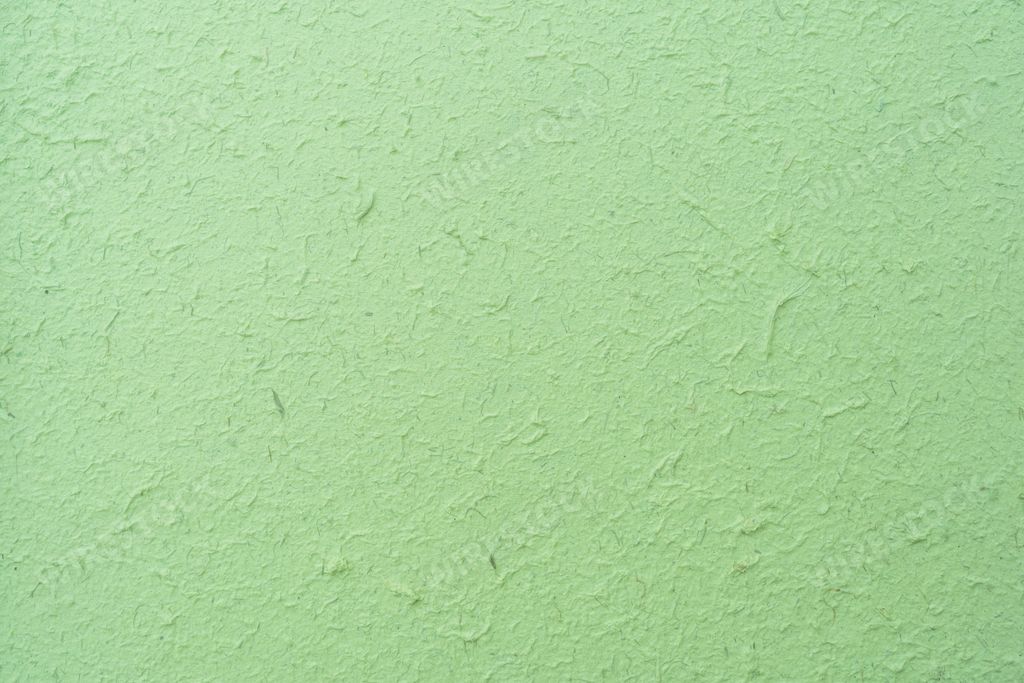 The wall of the light green plaster for background and wallpaper
