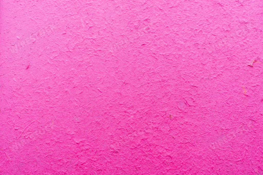 A pink background texture of the putty decorative wall