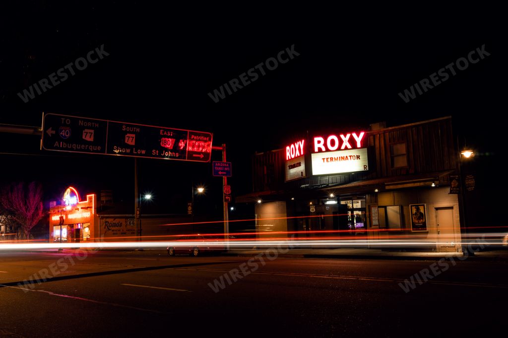 A closeup of light streaks from passing cars in front of a movie theatre in Holbrook, Arizona.
