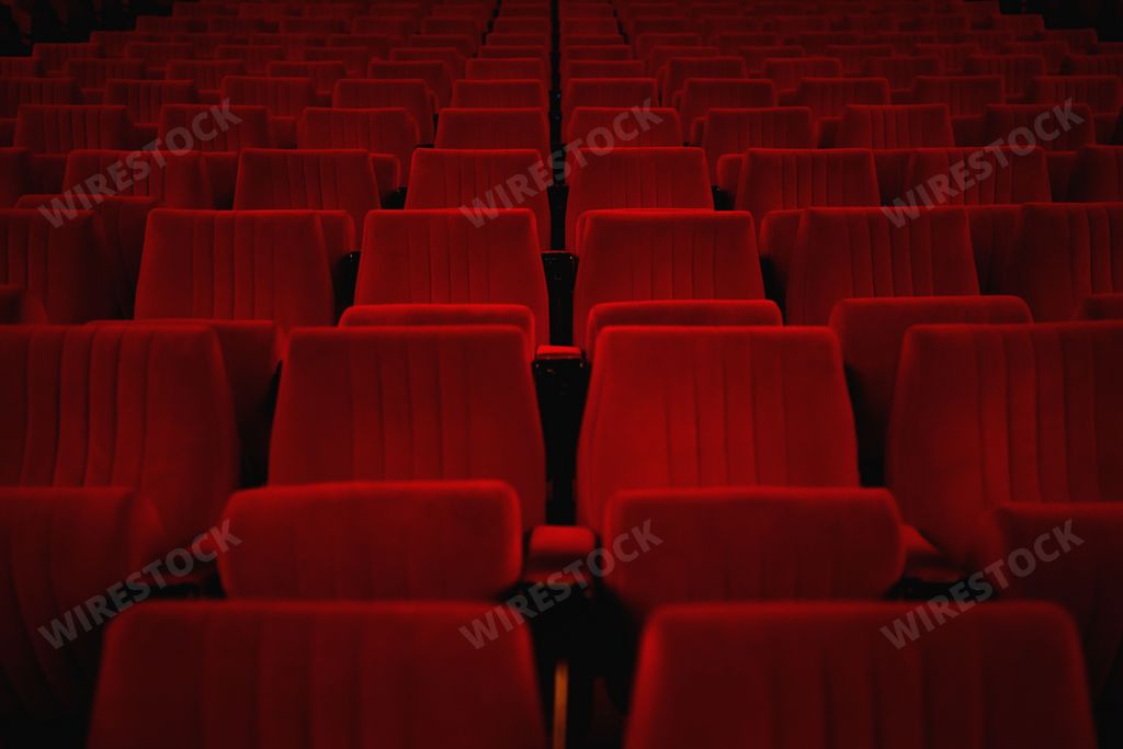 A beautiful view of empty red theater seats- perfect for background and wallpaper use