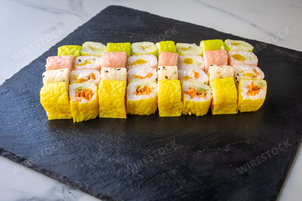 The fresh sushi rolls on a black board