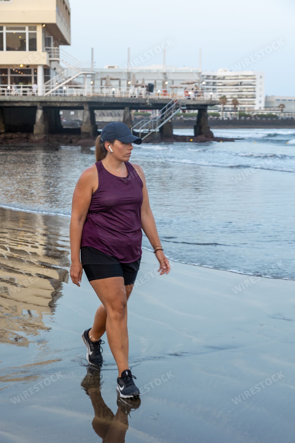 A thick Spanish female walking along the seashore, Santa Cruz de Tenerife, Spain