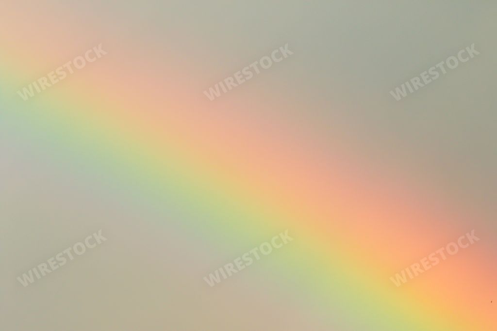 A multicolored sunbeam on a gray cloudy day