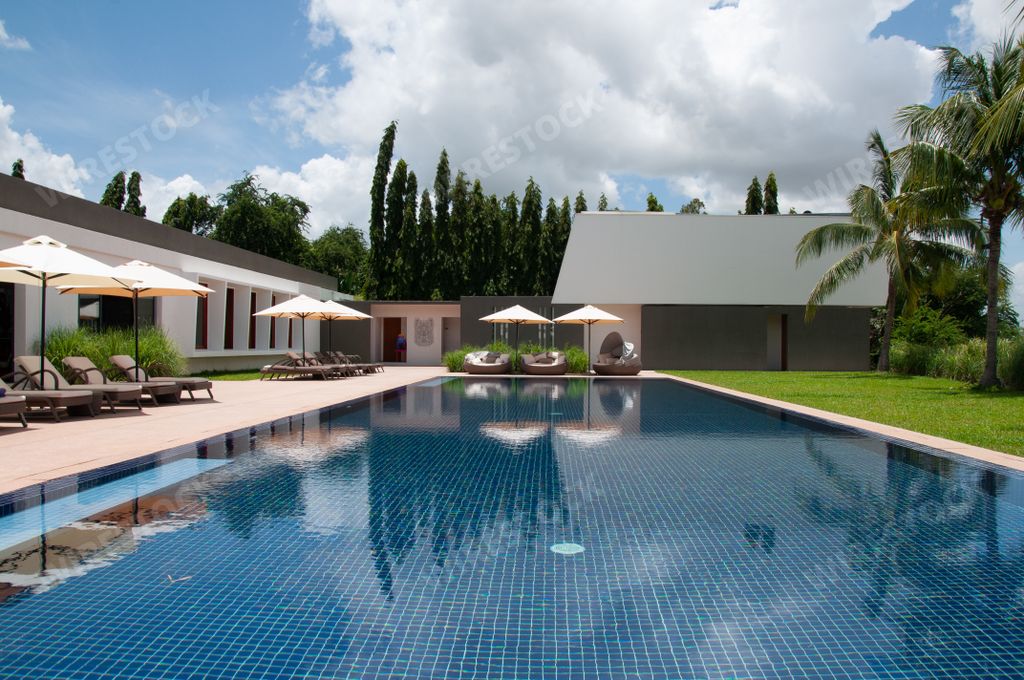 A beautiful scenery of the pool surroundings reflecting in the water in Phnom Penh in Cambodia