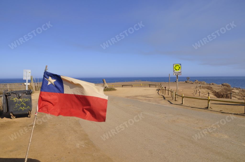 The beautiful view of the Chilean flag near the beach in Punta de Lobos, Pichilemu on a sunny day