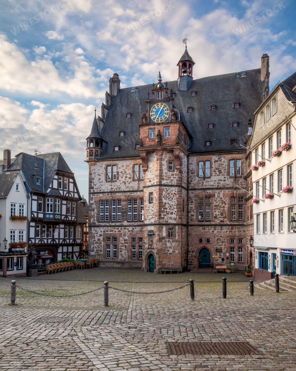 The majestic Town Hall of Marburg in Hesse, Germany under dramatic cloudy sky