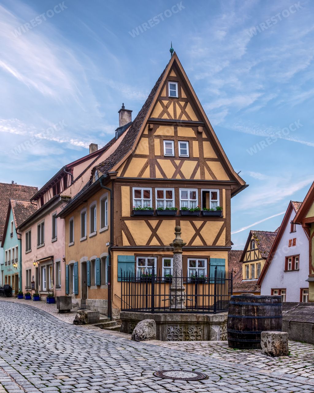 A charming half-timbered house on a cobblestone street in Rothenburg ob der Tauber, Germany