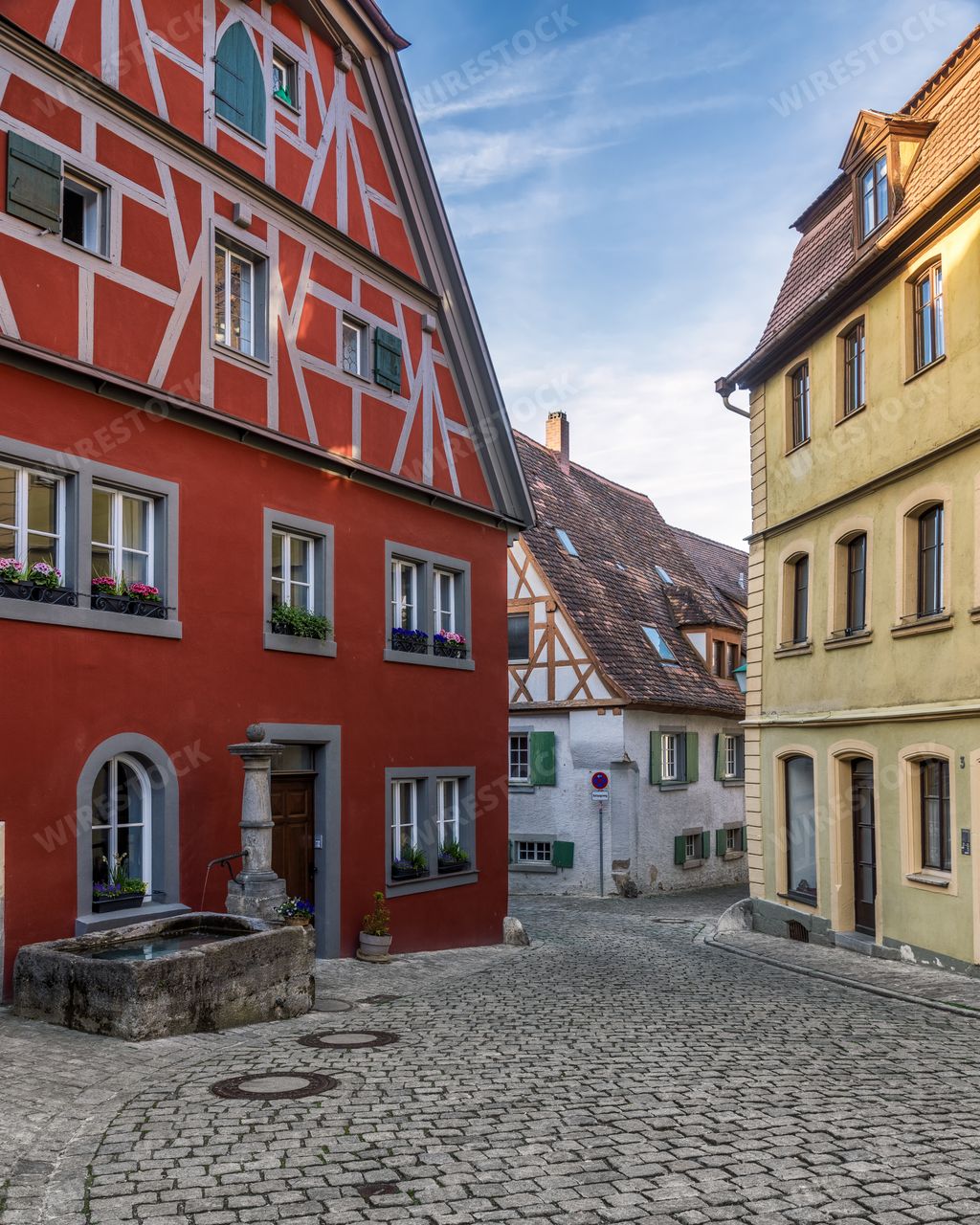 A colorful European street with old-style houses and surrounding area