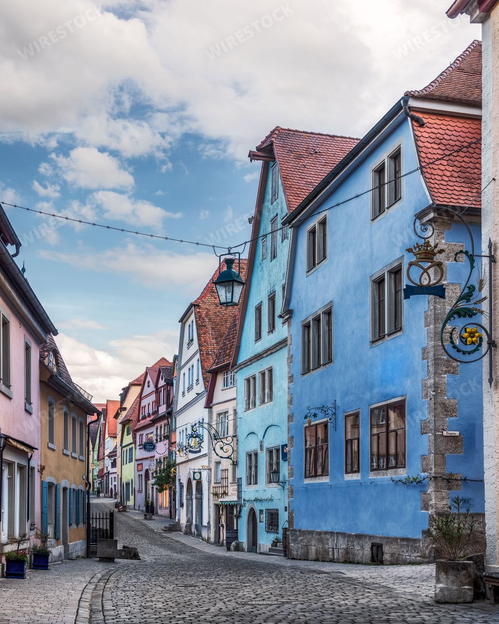 A Beautiful cobblestone street with typical old colorful german buildings in old town of the medieval fairytale Rothenburg ob der Taber