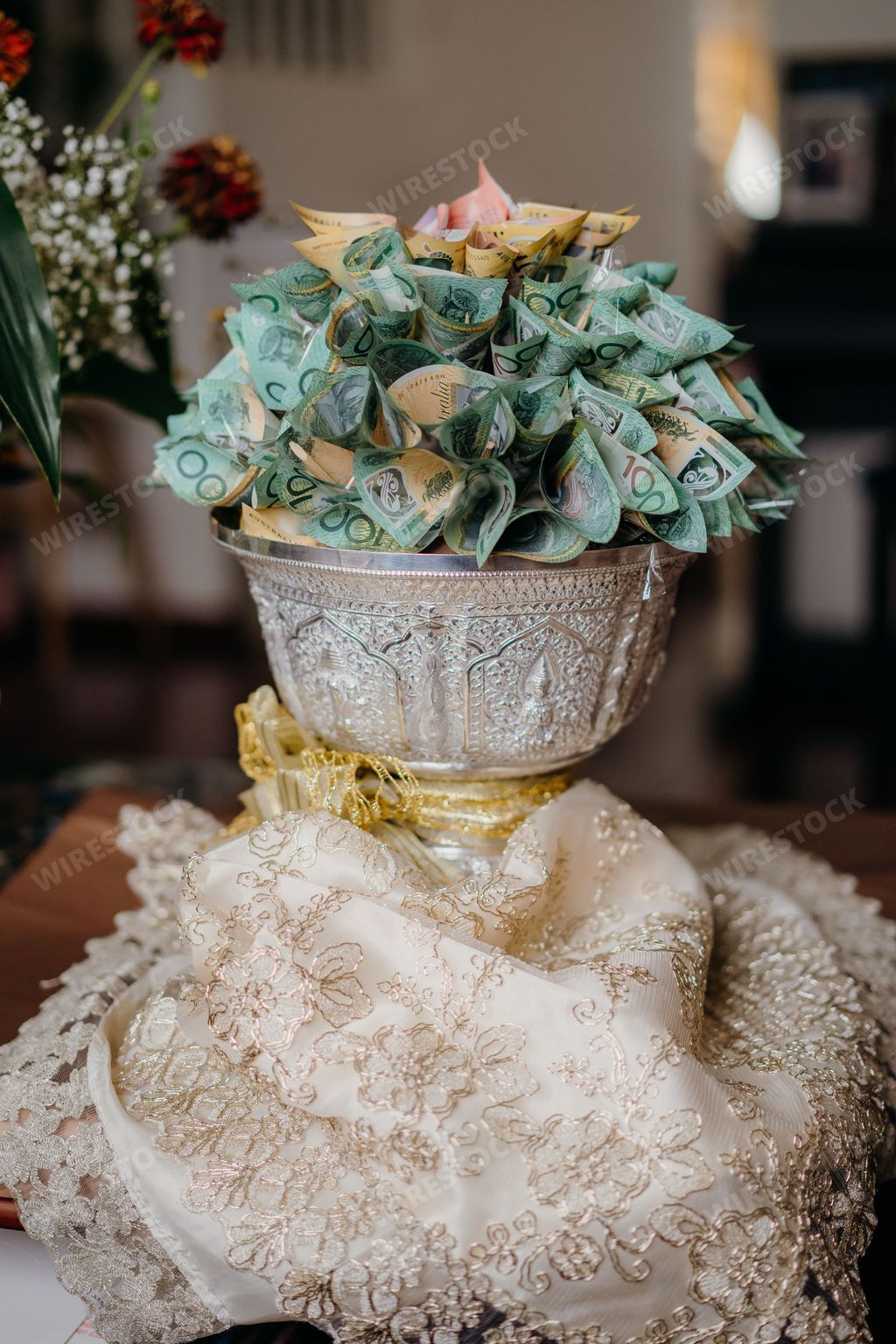 A traditional Cambodian wedding money vase, handcrafted from ceramic with intricate floral designs