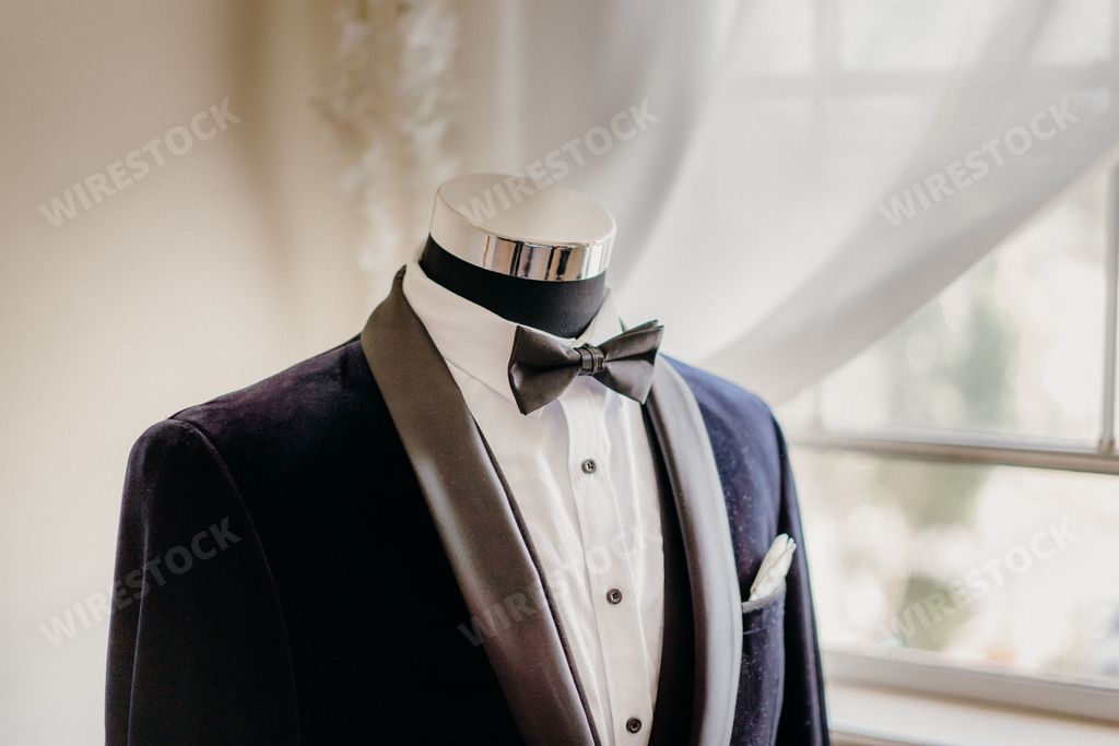 A closeup of a groom's suit on a mannequin
