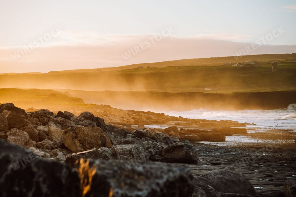 A beautiful view of the rocky river bank at sunrise in Ireland