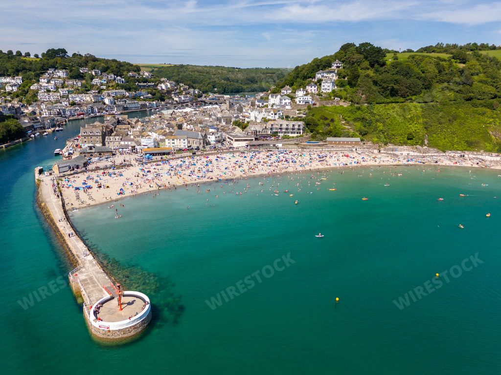 An aerial view of the Banjo Pier and Looe Beach on a sunny day in Looe town, Cornwall, England, UK