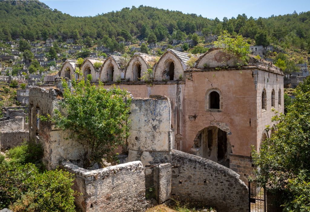 The ruins of the ghost town of Kayakoy on a sunny day in Kayakoy neighborhood, Fethiye, Mugla, Turkey