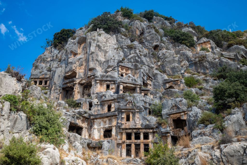 The ancient Lycian rock-cut tombs carved into cliffs at the Myra Ancient City in Demre, Antalya, Turkey