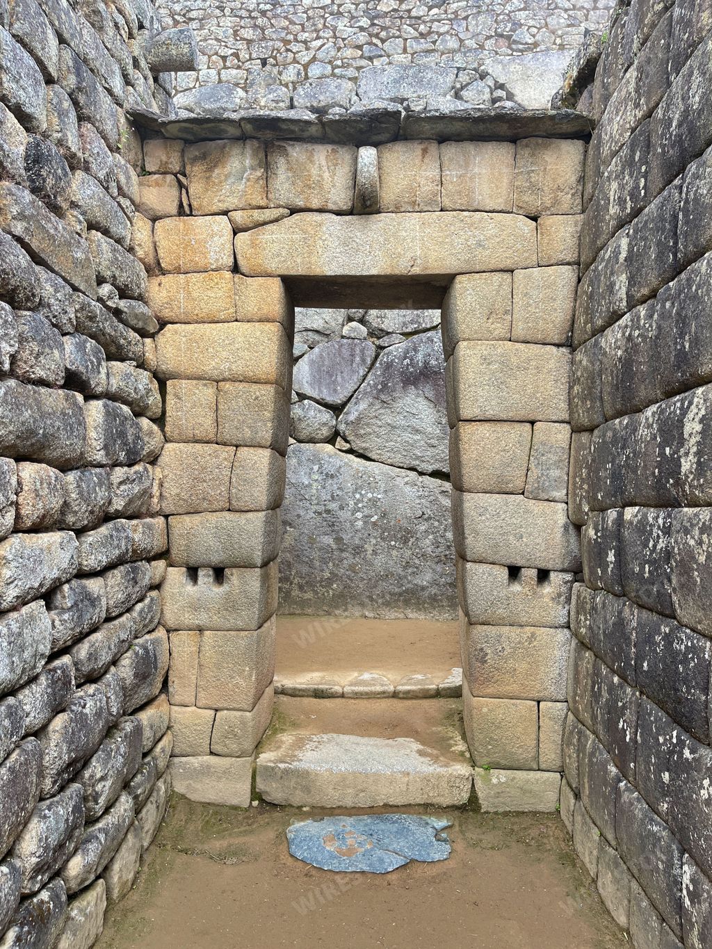 A vertical shot of the ruins of Machu Picchu in Peru