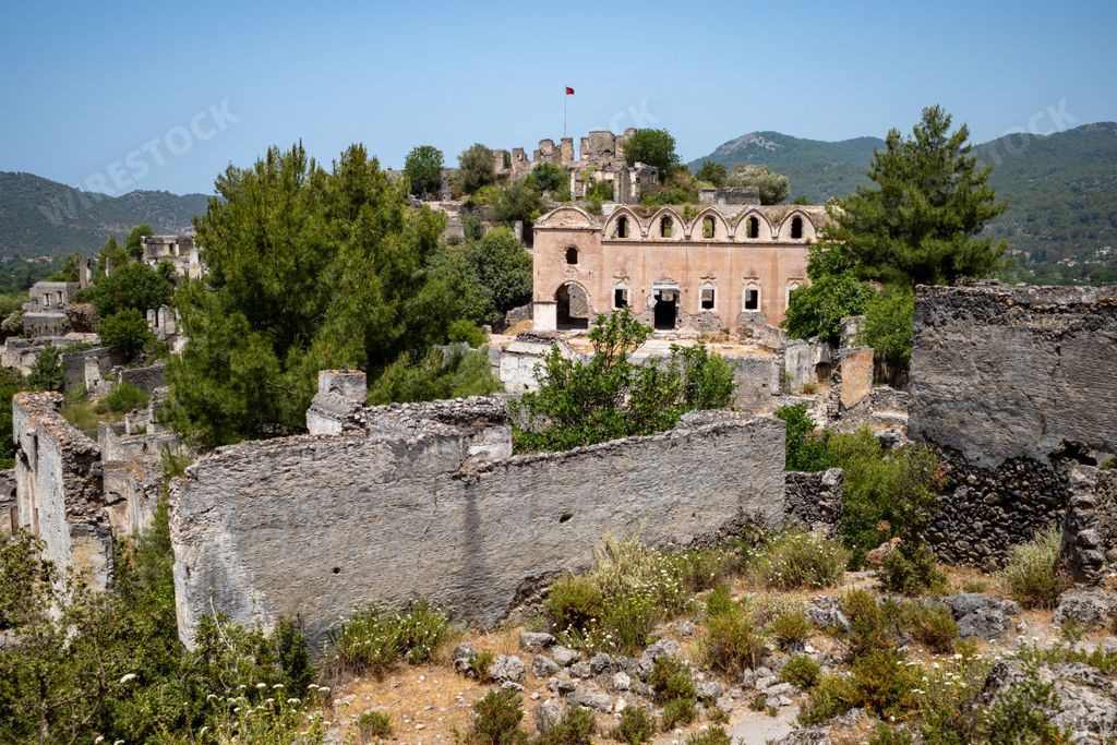 The ruins of the ghost town of Kayakoy on a sunny day in Kayakoy neighborhood, Fethiye district, Mugla Province, Turkey
