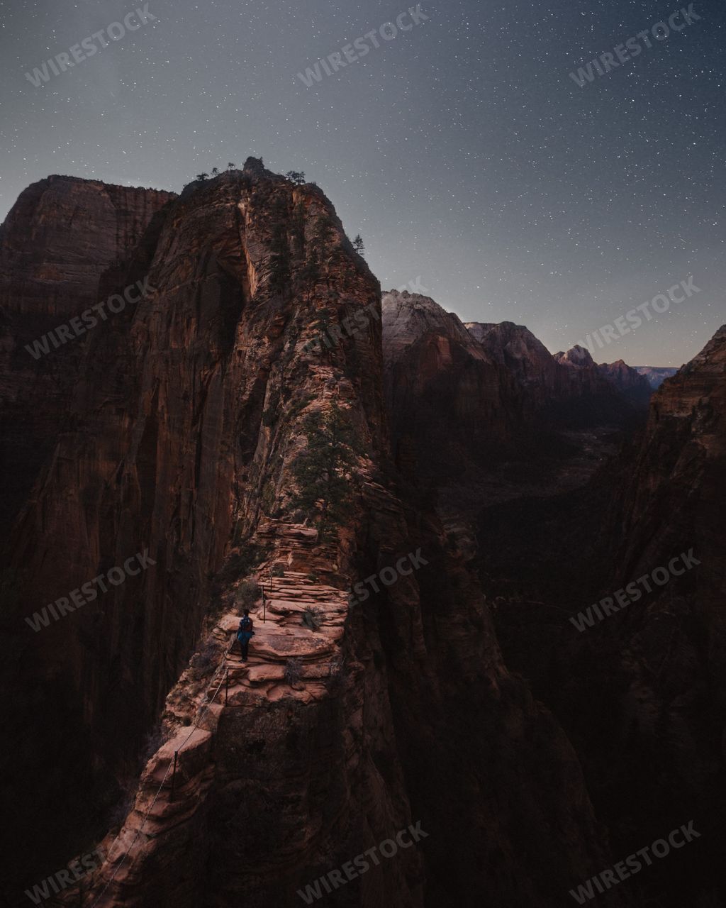 Beautiful rocky mountains and hills with amazing breathtaking starry sky at night