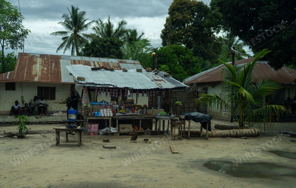 An idyllic scene of an outdoor shop nestled amidst lush greenery in Mocimboa da Praia, Mozambique