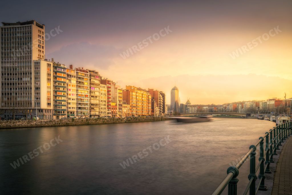 A scenic view of the Meuse river passing through the city of Liege, Belgium