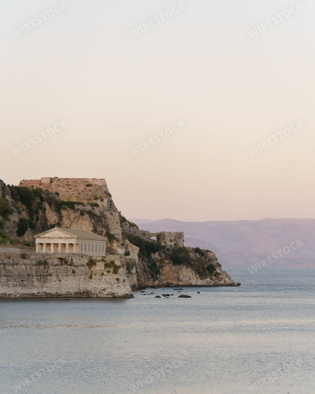A vertical shot of the Old Venetian Fortress surrounded by the sea in Corfu, Greece
