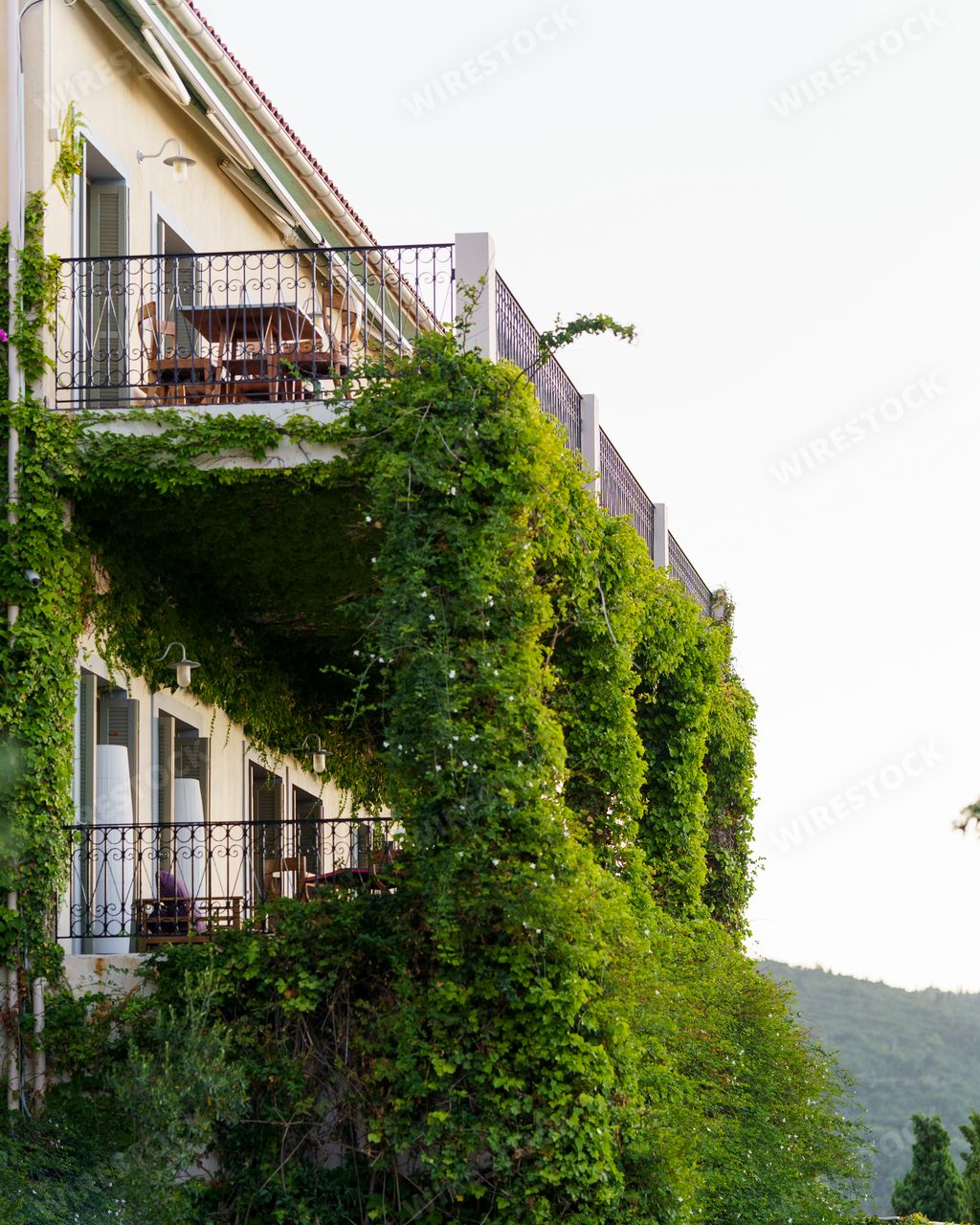 A vertical shot of the green balcony of Emelisse Nature Resort,  Fiskardo