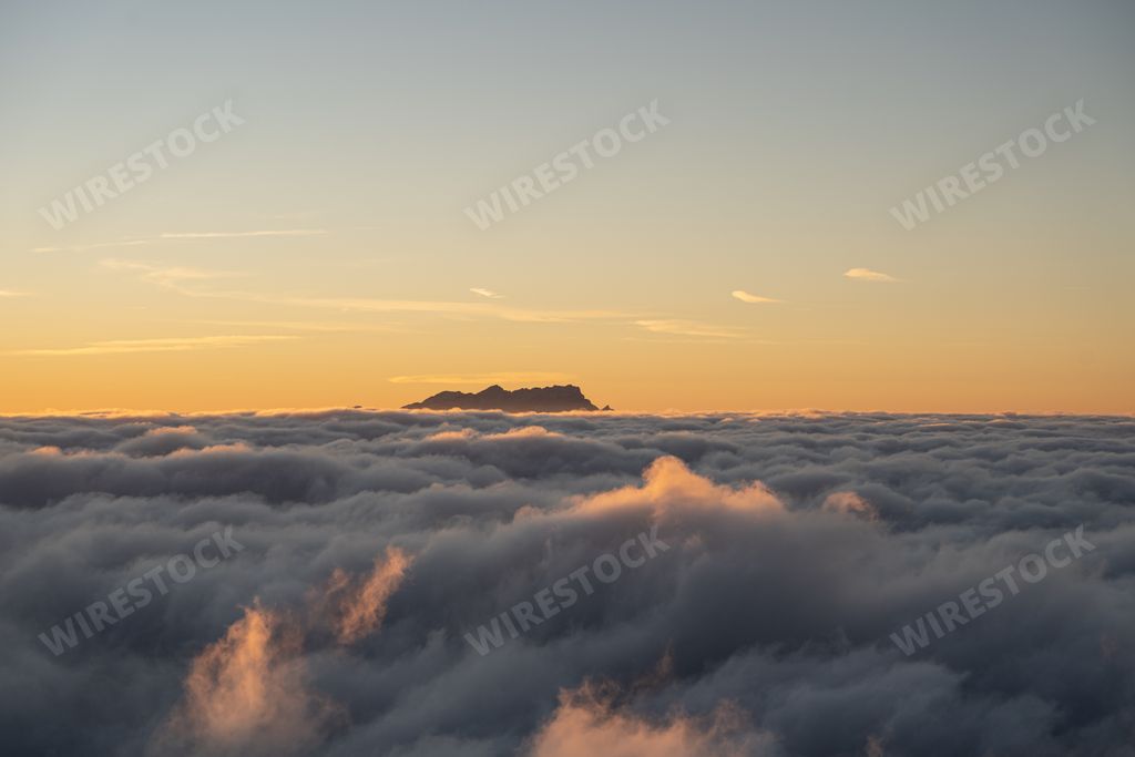 A sunset over clouds at Mount Niederbauen in Switzerland