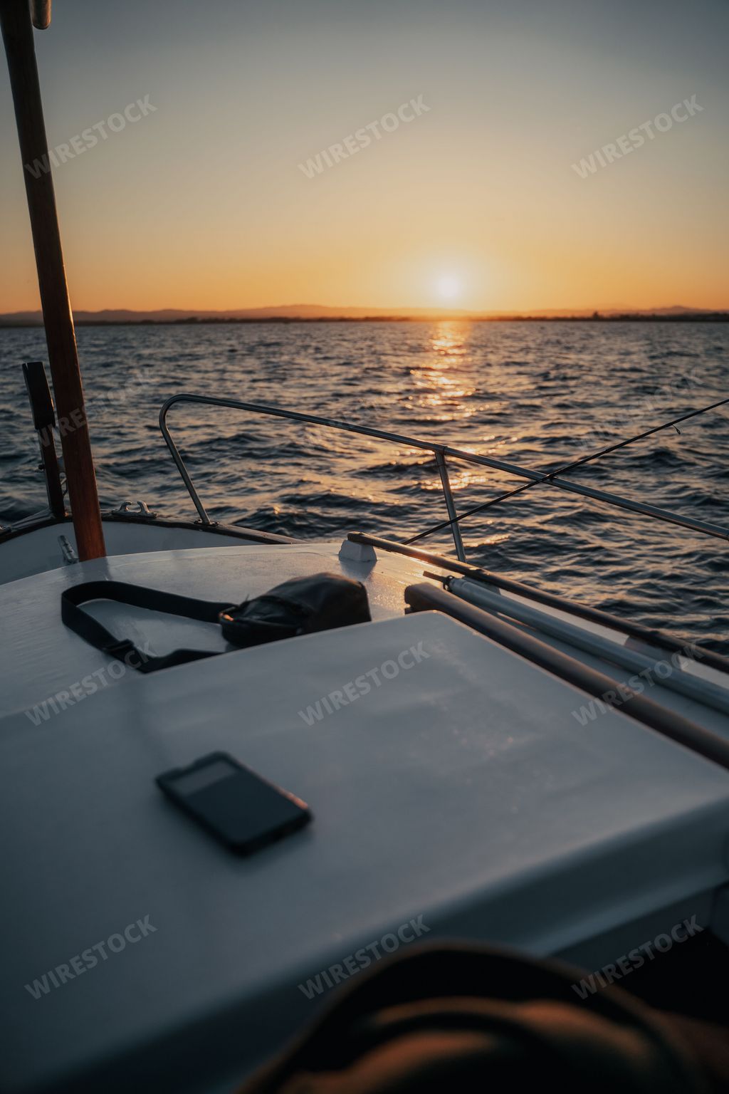 A scenic view of a tranquil lake from the perspective of a small boat