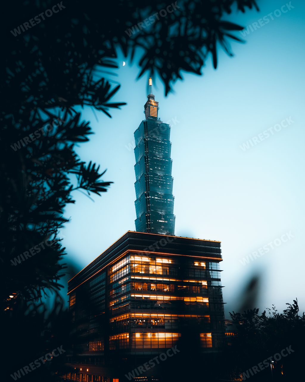 The Taipei one hundred one modern building against a blue sky at sunset in Taiwan
