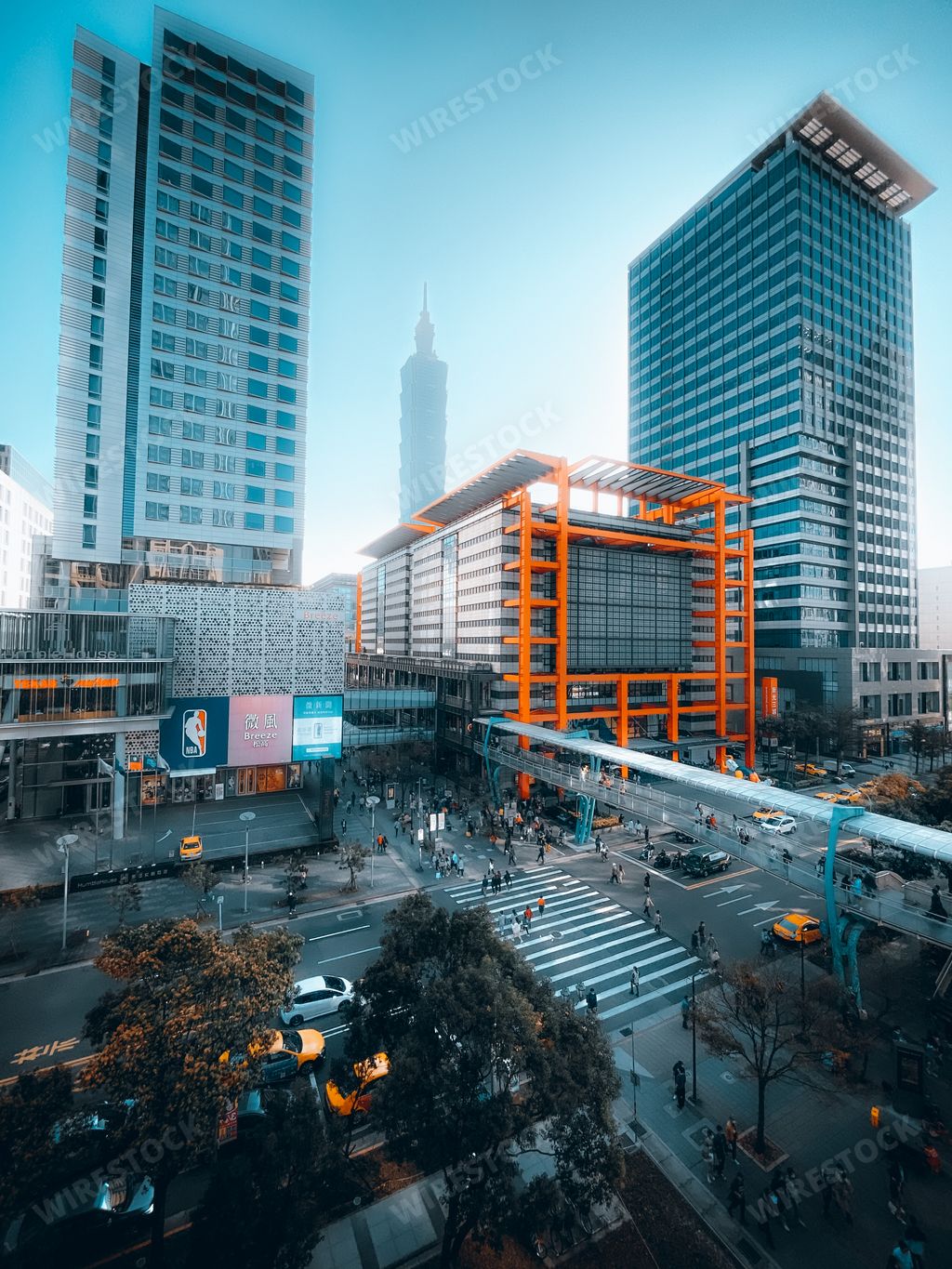 The city street view with modern buildings against a blue sky in Taipei, Taiwan