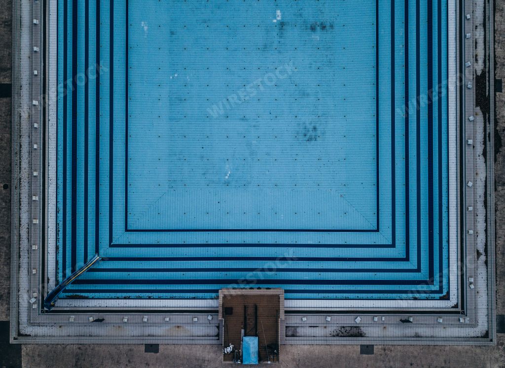 Symmetric view of an old swimming pool shot from above