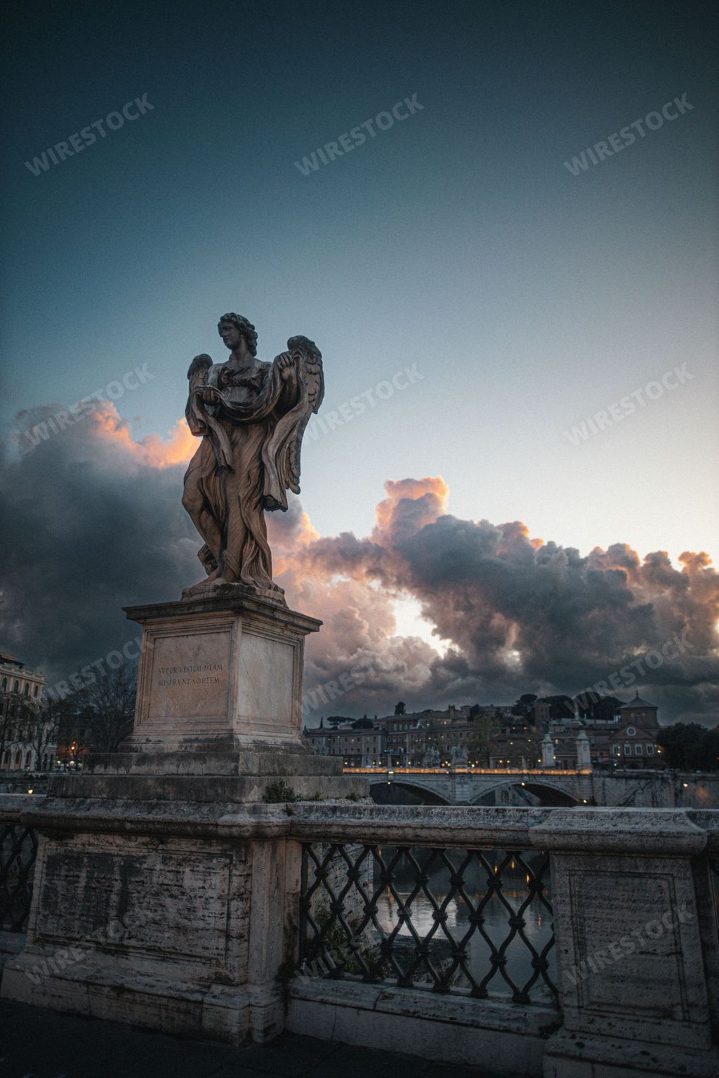 A vertical shot of an angel statue at the St. Angelo Bridge in Rome, Italy