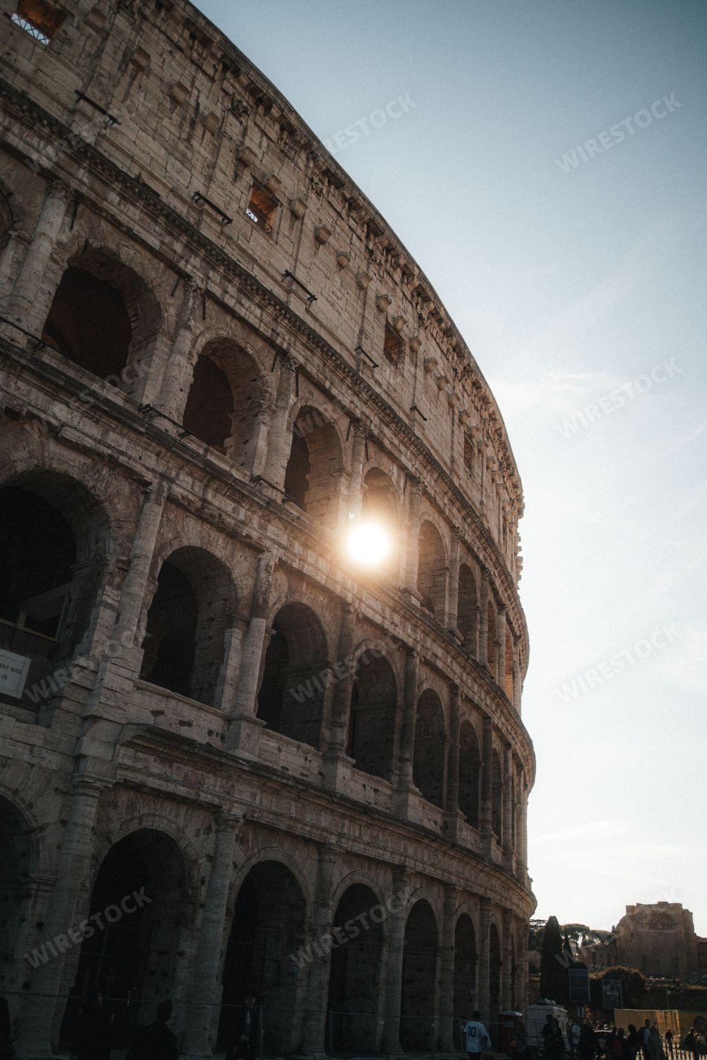 A vertical shot of the Colosseum during the golden hour in Rome, Italy