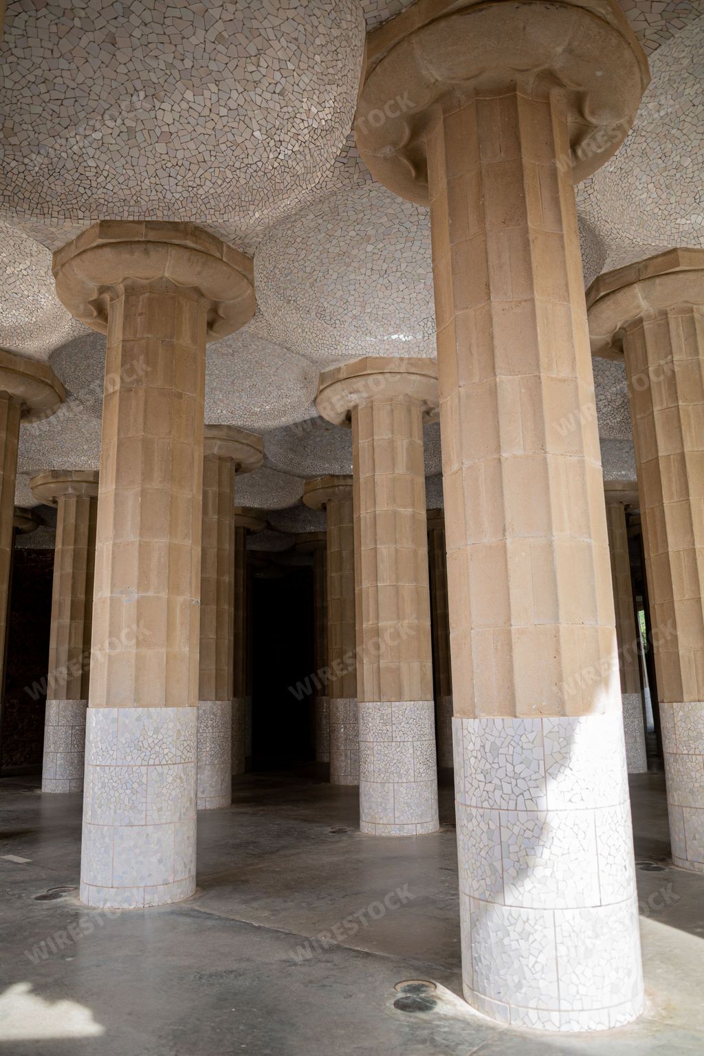 A vertical shot of columns under the building in Barcelona, Spain