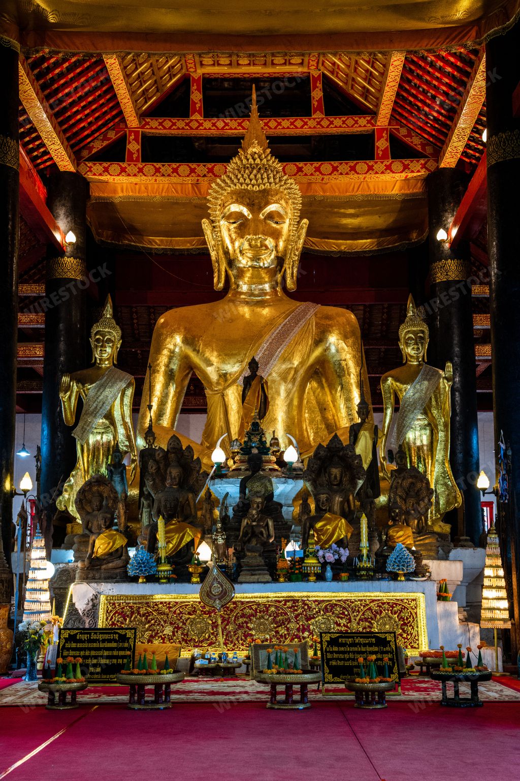 A beautiful shot of Buddha sculptures inside Wat Visoun in Luang Prabang, Laos