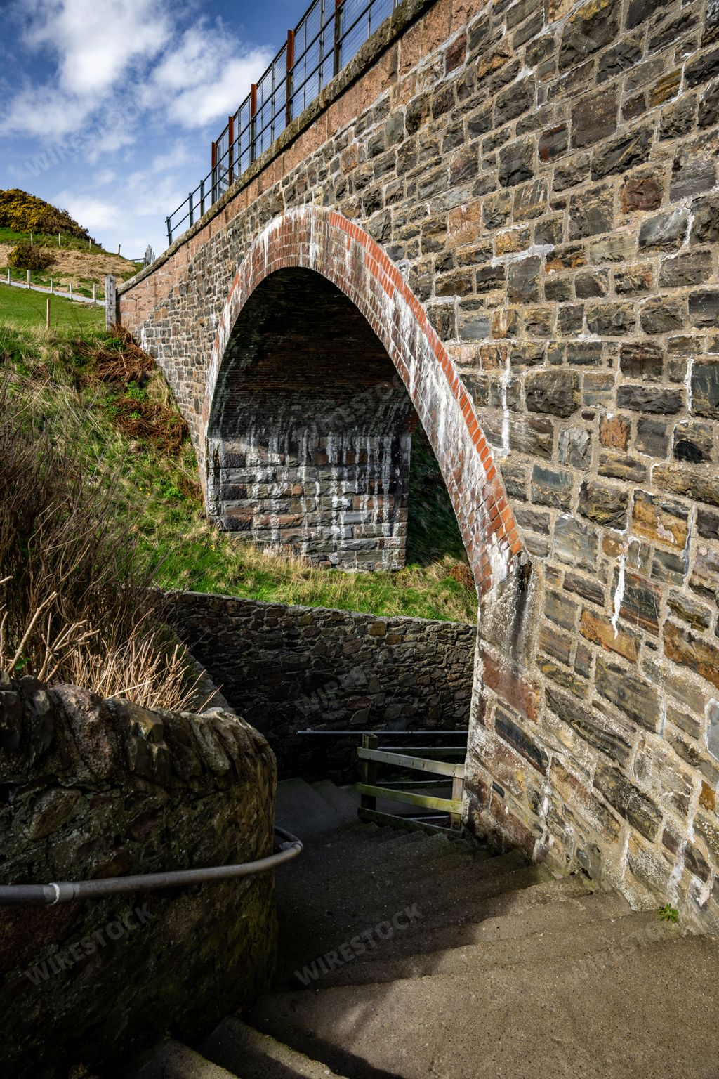 Stairs leading under a stone bridge in Buckie on Moray Firth coast of Scotland