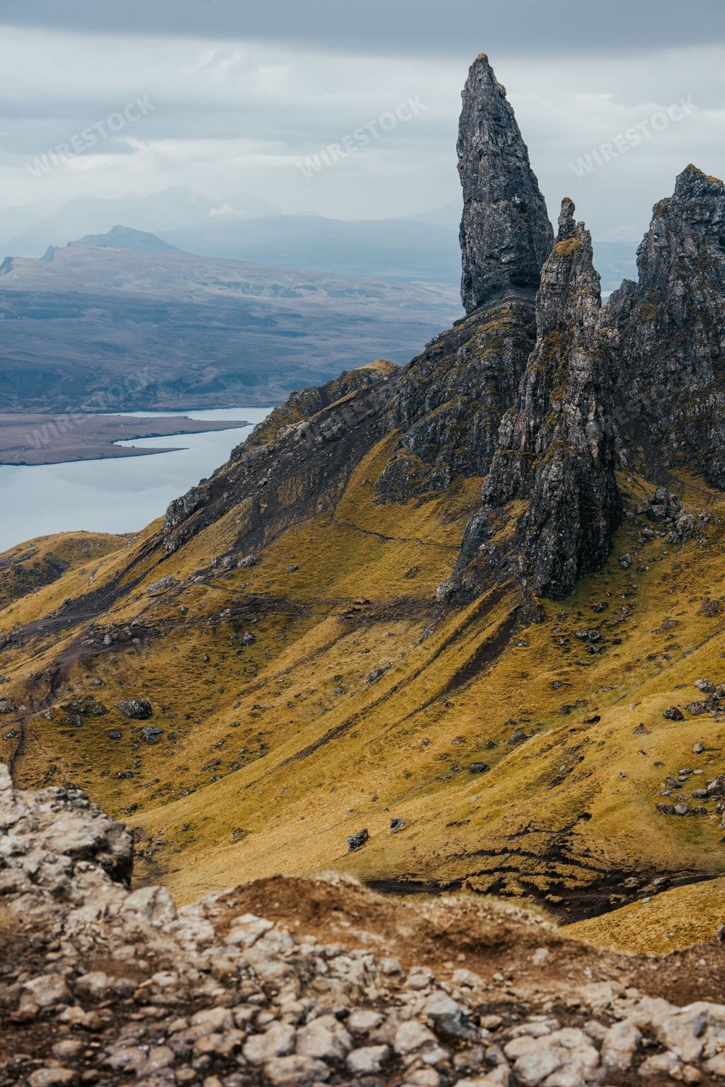A vertical shot of the Old Man of Storr rock formation on the Isle of Skye