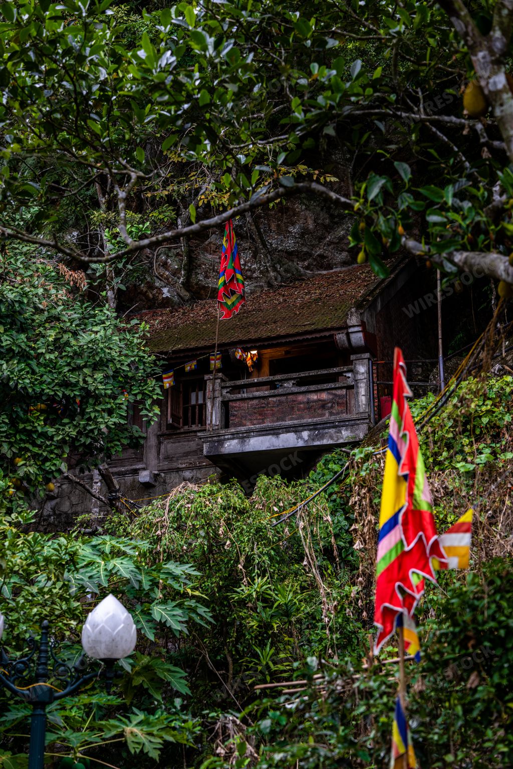 A picturesque Asian Buddhist temple shrine set amidst the stunning Yen Tu Mountain landscape