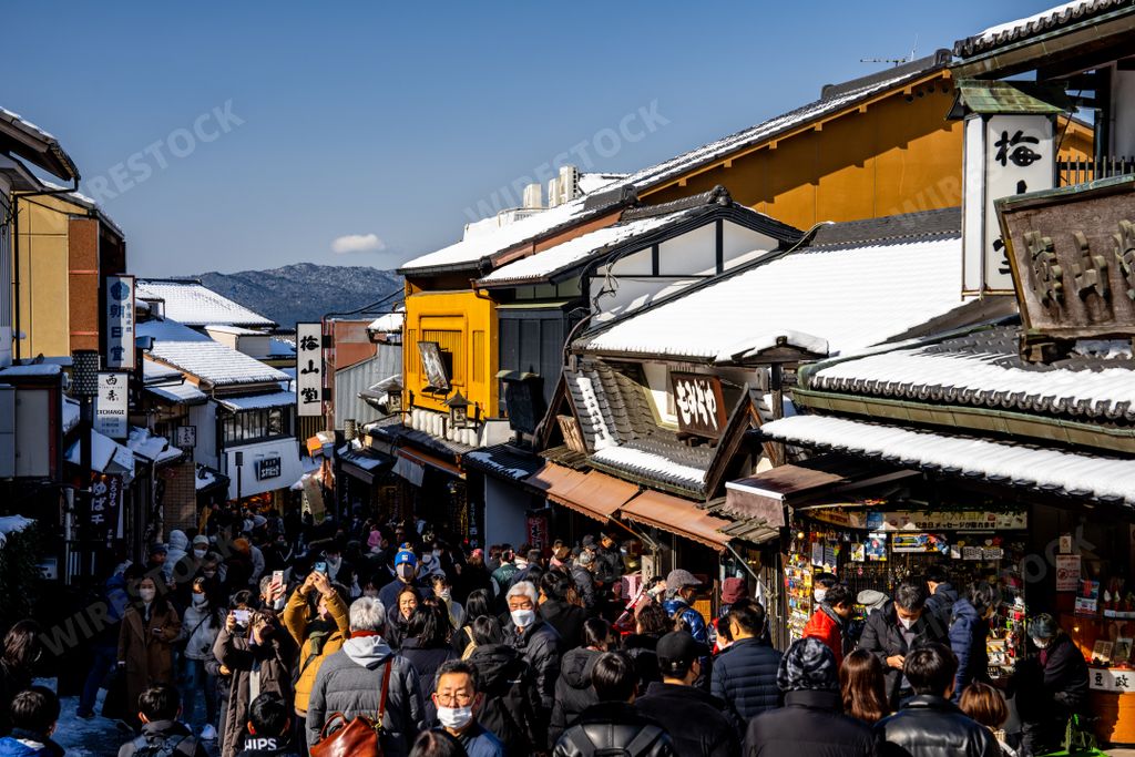 The crowd walking on the city street in Kyoto. Japan