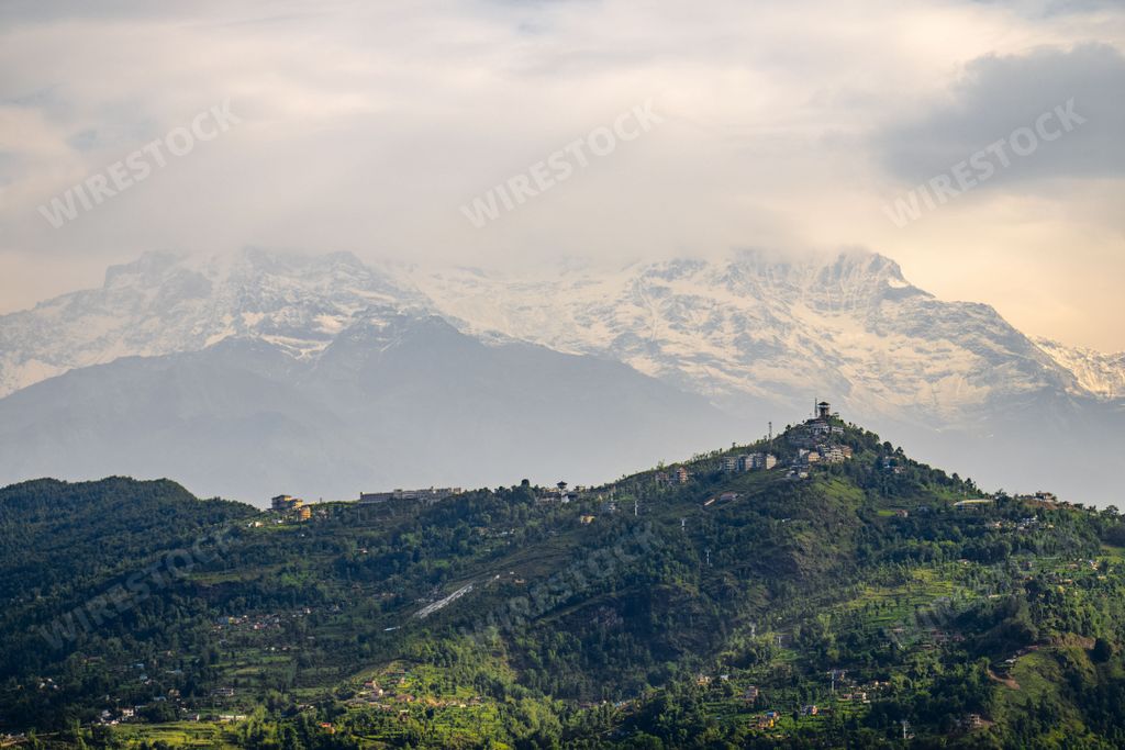 The view of green hills and the Annapurna mountain range in the background. Pokhara, Nepal.