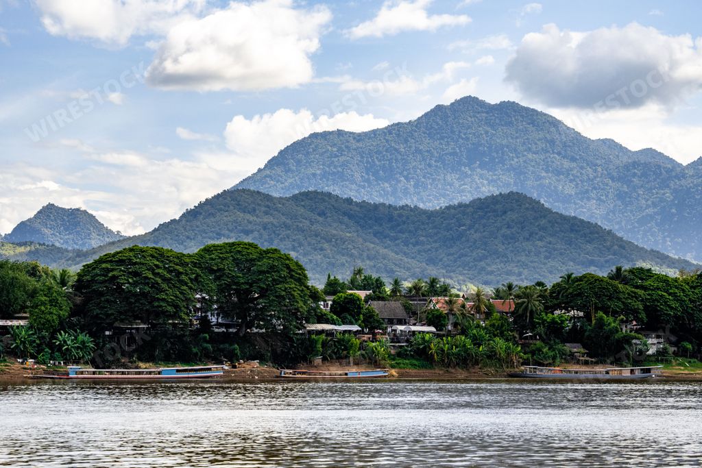 A beautiful shot of the view of mountains from the Mekong River in Luang Prabang, Laos
