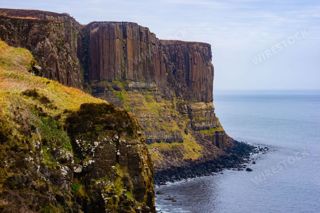 The beautiful view of the green cliffs on the Isle of Skye. Kilt Rock, Scotland, UK.