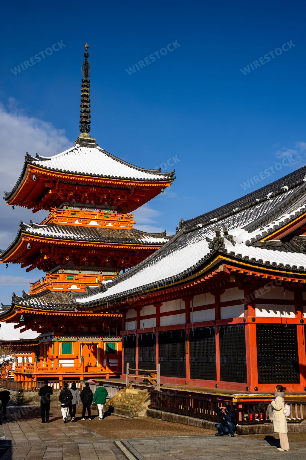 A View of Japanese people crowd at rare snow covered Kiyomizudera Temple with ancient pagodas, gates, and temple complex in Kyoto Japan